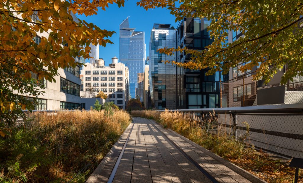 New York view of The High Line promenade in Fall. Elevated greenway with Hudson yards skyscrapers. Manhattan (Chelsea)