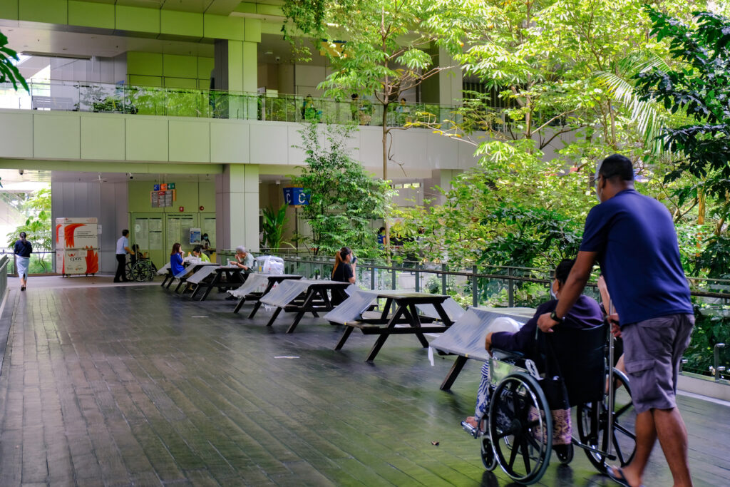 Singapore May2020 Covid-19 Yishun Khoo Teck Puat Hospital interior. Tables partially wrapped with plastic to limit gathering, Social distancing measures; coronavirus outbreak, circuit breaker.